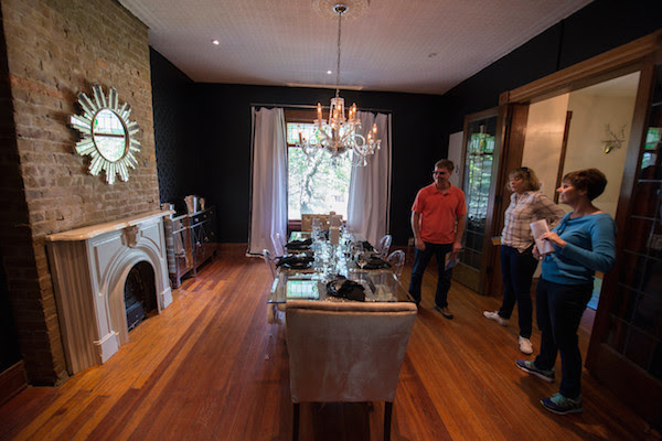 Visitors explore a newly renovated historic home in Bellevue