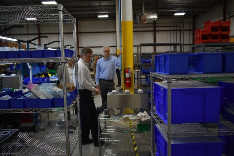 Wes Morin, VP of operations at AquiSense Technologies, demonstrates the company's sterilization product.