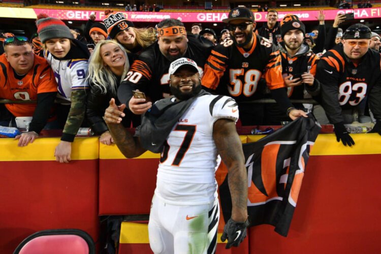 Bengals fans at Kansas City's Arrowhead Stadium rejoice with offensive lineman Quinton Spain.