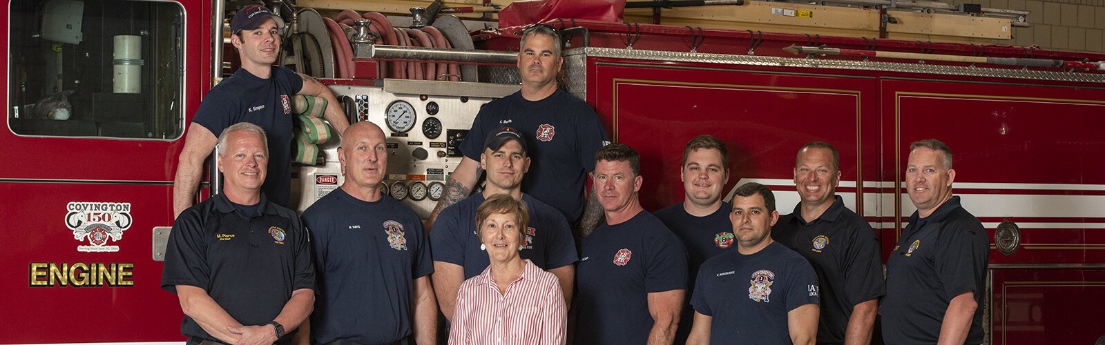 Jo Terry, center, and some of the crew of Company 1 in Covington.