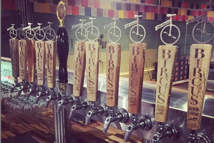 Ornate beer taps with unicycles on the top add flourish at Bircus Brewery.
