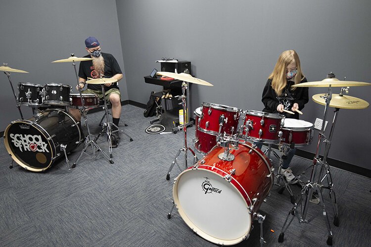 Drum instructor Stephen Schwarz and student Addison Carver.