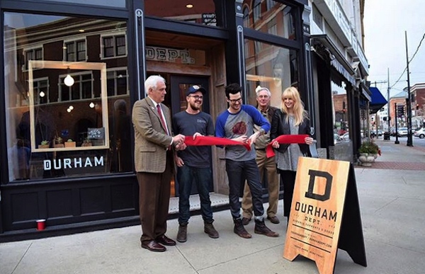 Austin Dunbar (center) opens the Dunham Dept. retail store at Madison & Pike Sts. in Covington
