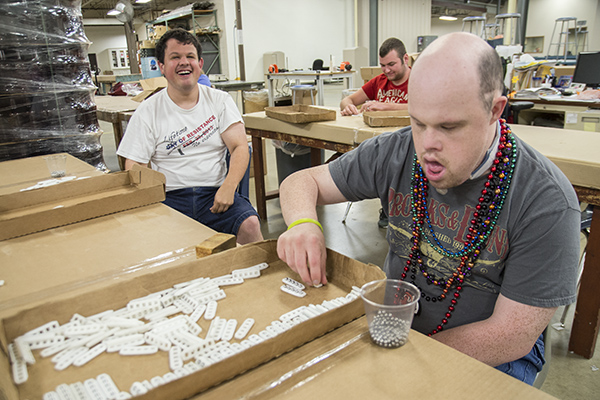 Nick Garera (left) and Chris Bryan (front right) at BAWAC's warehouse facility in Florence