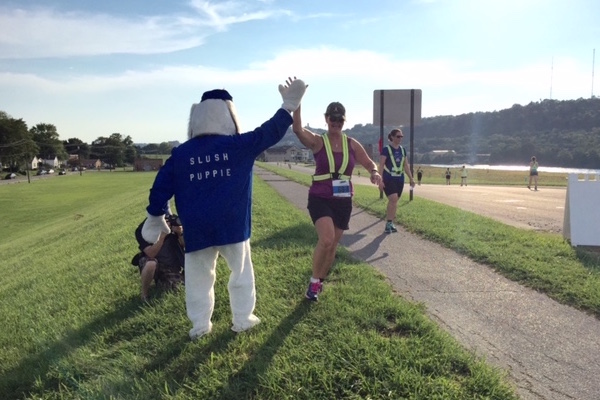 Catherine Hamilton Hicks' husband dressed in an old Slush Puppie mascot costume to greet runners in Dayton last month