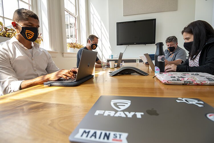 The team, hard at work in their downtown office.