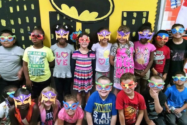 Children dress as superheroes at Covington's John G. Carlisle Elementary.