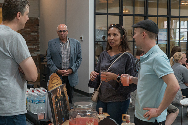 Guests mingle over cocktails provided by Second Sight Spirits in Latonia.