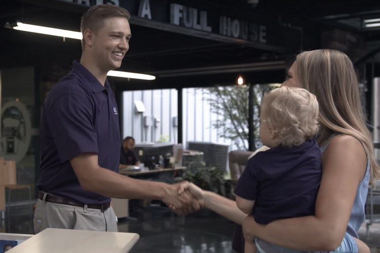 Brady Jolly greeting customers in his company's lobby.