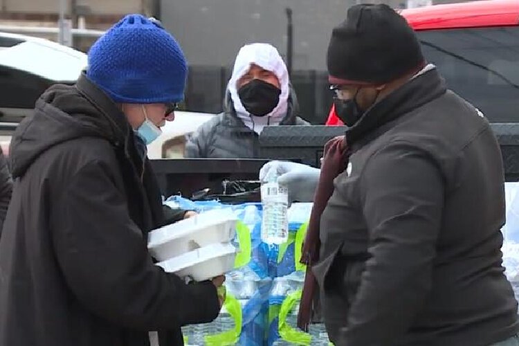 Manuel Foggie distributing meals and other necessities.